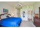 Main bedroom with soft carpet, ceiling fan, and access to closets at 2218 Brookfield Greens Cir # 82, Sun City Center, FL 33573