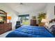 Main bedroom with lake view, ceiling fan, soft carpet, and a cozy reading chair at 2218 Brookfield Greens Cir # 82, Sun City Center, FL 33573