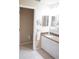 Bathroom with single vanity, granite counters, and linen closet at 2325 Brookfield Greens Cir # 41, Sun City Center, FL 33573