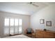 Bright bedroom featuring plantation shutters and neutral decor at 2325 Brookfield Greens Cir # 41, Sun City Center, FL 33573
