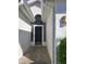 Front door with arched window, screen door, and concrete walkway at 2325 Brookfield Greens Cir # 41, Sun City Center, FL 33573