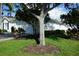 Charming home with a well-maintained front yard, mature trees, and a two-car garage at 2325 Brookfield Greens Cir # 41, Sun City Center, FL 33573