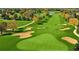 Scenic aerial view of a lush golf course featuring sand traps, manicured greens, and tree-lined fairways at 2325 Brookfield Greens Cir # 41, Sun City Center, FL 33573