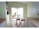 Eat-in kitchen area with round table and view of outdoor patio at 2325 Brookfield Greens Cir # 41, Sun City Center, FL 33573