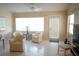 Bright living room with large windows, neutral colors, and comfortable seating at 2325 Brookfield Greens Cir # 41, Sun City Center, FL 33573