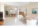 Bright living room featuring tile floors, neutral paint, dining set, and comfortable seating at 2325 Brookfield Greens Cir # 41, Sun City Center, FL 33573