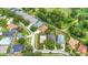 An aerial view features homes with private backyard pools in a neighborhood with green trees at 2601 Brookville Dr, Valrico, FL 33596