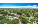 Beautiful homes line the street of this aerial view with lush landscaping and neighborhood sidewalks at 2601 Brookville Dr, Valrico, FL 33596