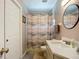 Clean, tidy bathroom with white vanity, a shower and a rug at 2601 Brookville Dr, Valrico, FL 33596