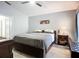 Spacious bedroom features a ceiling fan, natural light, and minimalist decor at 2601 Brookville Dr, Valrico, FL 33596