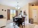 Inviting dining space with a view of the laundry room and ample natural light at 2601 Brookville Dr, Valrico, FL 33596
