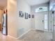 Inviting entryway with tile floors, neutral walls, and decorative window above the door at 2601 Brookville Dr, Valrico, FL 33596