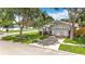 Inviting home showcasing the manicured lawn, mature trees, and serene street view at 2601 Brookville Dr, Valrico, FL 33596