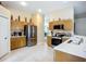 Spacious kitchen area with stainless steel appliances and modern finishes at 2601 Brookville Dr, Valrico, FL 33596