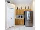 Efficient kitchen with stainless steel refrigerator and ample cabinet space at 2601 Brookville Dr, Valrico, FL 33596