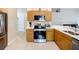 Functional kitchen featuring stainless steel appliances and bright countertops at 2601 Brookville Dr, Valrico, FL 33596