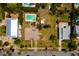 Property aerial view with a pool, highlighting its location and surroundings at 3111 S De Bazan Ave, St Pete Beach, FL 33706