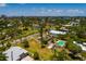 A beautiful community featuring a home with swimming pool, park, tennis courts, lush vegetation, and tranquil canals at 3111 S De Bazan Ave, St Pete Beach, FL 33706