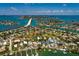 Beautiful waterfront community, clear blue water, and a bright blue sky highlight this lovely property at 3111 S De Bazan Ave, St Pete Beach, FL 33706