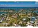 Lovely waterfront community with canals and bridges amid lush greenery and blue skies at 3111 S De Bazan Ave, St Pete Beach, FL 33706