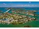 Overhead view of canal-front homes in a coastal area, illustrating the unique waterfront living experience at 3111 S De Bazan Ave, St Pete Beach, FL 33706