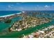 Expansive aerial view of waterfront property, highlighting its location and access to both the ocean and bay at 3111 S De Bazan Ave, St Pete Beach, FL 33706