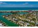 Breathtaking aerial view of waterfront property, showcasing its prime location near the beach and stunning ocean views at 3111 S De Bazan Ave, St Pete Beach, FL 33706