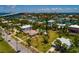 An attractive neighborhood featuring canals, a bridge to the city, mature trees and a home with a swimming pool at 3111 S De Bazan Ave, St Pete Beach, FL 33706