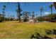 Spacious backyard featuring a pool and lots of greenery, perfect for outdoor activities at 3111 S De Bazan Ave, St Pete Beach, FL 33706