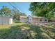 Backyard featuring a white building, shed, and an outdoor area at 3256 Adrian Ave, Largo, FL 33774