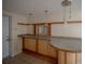 Home bar area featuring a large countertop, pendant lighting, and unique design at 3256 Adrian Ave, Largo, FL 33774