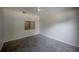 Spacious bedroom featuring a ceiling fan, vaulted ceiling, and carpet flooring at 3256 Adrian Ave, Largo, FL 33774