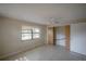 Bedroom featuring tile floors, a ceiling fan, and a closet at 3256 Adrian Ave, Largo, FL 33774