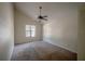 Bright bedroom with a ceiling fan, vaulted ceiling, and window allowing ample natural light at 3256 Adrian Ave, Largo, FL 33774