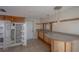 Functional kitchen with ample cabinet space, breakfast bar, and tile floors at 3256 Adrian Ave, Largo, FL 33774