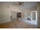 Inviting living room with vaulted ceilings, tile and laminate floors, and multiple entry points at 3256 Adrian Ave, Largo, FL 33774