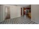 Spacious living area with tile flooring, leading into the kitchen and bedrooms at 3256 Adrian Ave, Largo, FL 33774