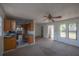 View of the open floorplan featuring the living room, kitchen, and front entry at 3258 Adrian Ave, Largo, FL 33774