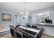 Cozy dining area featuring modern table and chairs, seamlessly connected to the kitchen at 340 Causeway Blvd # 104, Dunedin, FL 34698