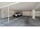 Secured parking garage featuring assigned parking spaces for residents at 340 Causeway Blvd # 104, Dunedin, FL 34698