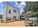 Spacious backyard with outdoor kitchen, dining area, and lush landscaping at 3405 W Palmira Ave, Tampa, FL 33629