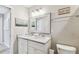 Bright bathroom featuring double sink vanity and decorative mirror at 3405 W Palmira Ave, Tampa, FL 33629
