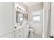 Bright bathroom features white cabinets, subway tile, and black and white checkered tile flooring at 3405 W Palmira Ave, Tampa, FL 33629