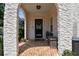 Charming arched brick entryway with black door and room for seating at 3405 W Palmira Ave, Tampa, FL 33629