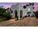 Charming two-story home with unique stucco exterior and brick driveway at 3405 W Palmira Ave, Tampa, FL 33629