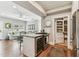Kitchen featuring a granite island with gas range and wine fridge with an open concept to the living room at 3405 W Palmira Ave, Tampa, FL 33629