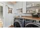 The laundry room has a sink, wooden countertop, shelving and a washer and dryer at 3405 W Palmira Ave, Tampa, FL 33629