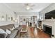 Inviting living room with hardwood flooring, fireplace, and an open layout at 3405 W Palmira Ave, Tampa, FL 33629