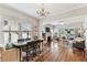 Spacious living and dining area with hardwood floors, a fireplace, and ample natural light at 3405 W Palmira Ave, Tampa, FL 33629