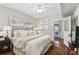 Serene main bedroom featuring ample natural light, hardwood floors, and neutral decor at 3405 W Palmira Ave, Tampa, FL 33629